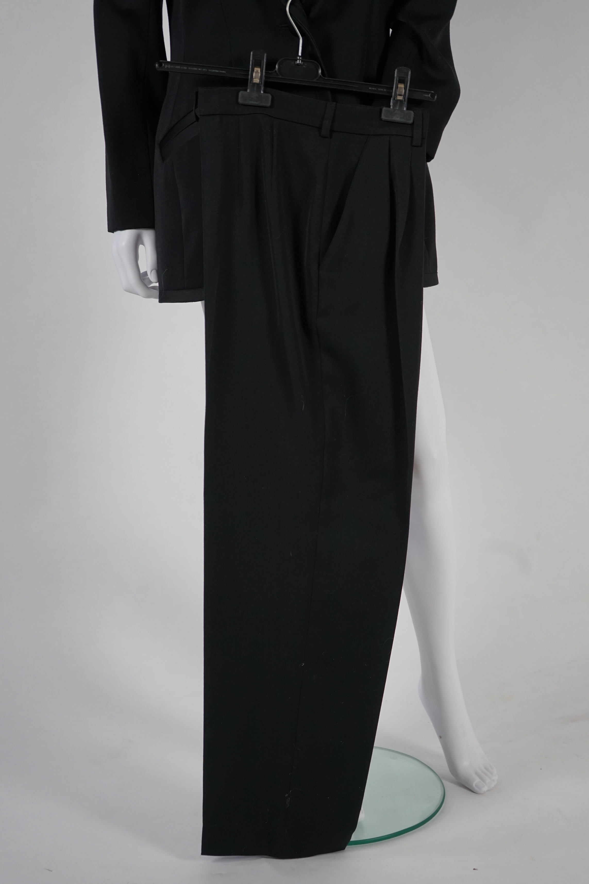 Two vintage Yves Saint Laurent lady's variation black trouser suits, F 42 (UK 14). Please note alterations to make the waist smaller may have been carried out on some of the skirts. Proceeds to Happy Paws Puppy Rescue.